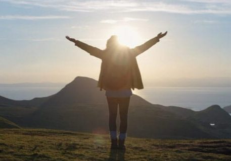 Person Standing in front of a sunerise